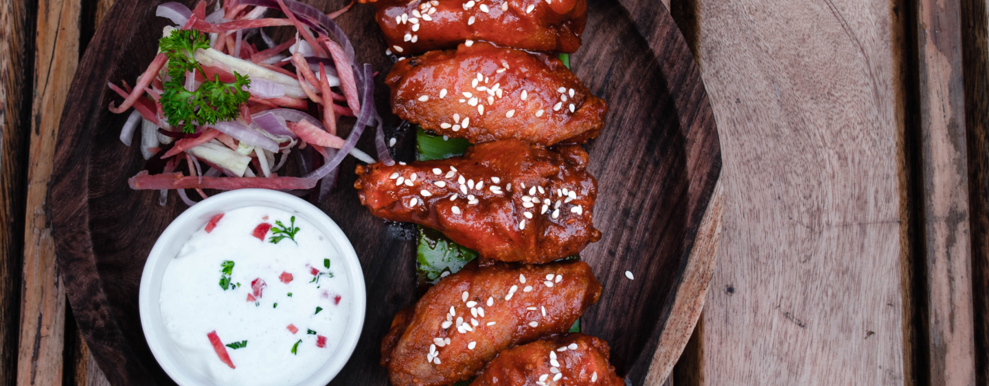 BBQ wings with side of vegetables and dipping sauce