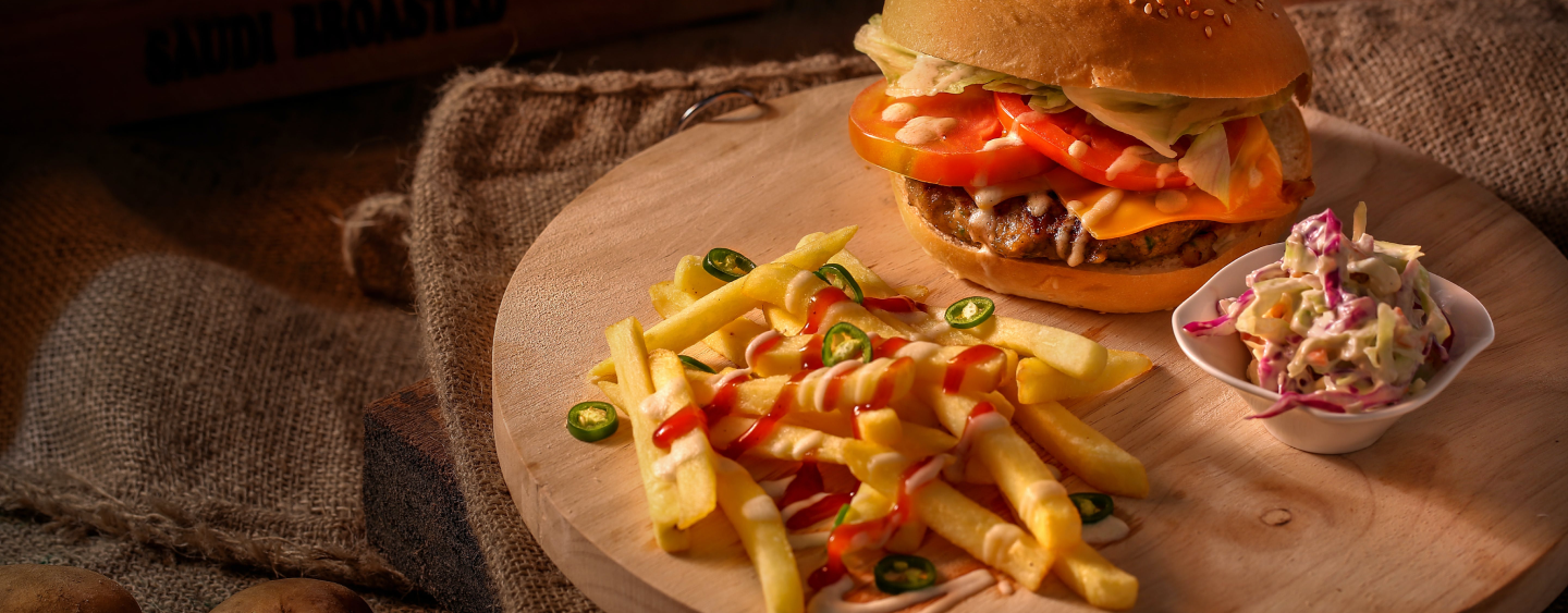 Burger served with side of french fries and cole slaw